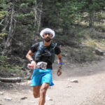 Runner coming into the aid station at castle peak